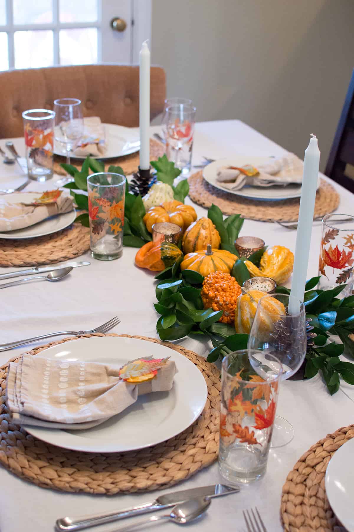 Thanksgiving tablescape with gourds and greenery
