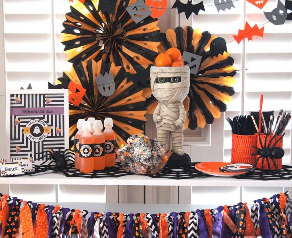 Halloween play date table styled by Sprinkles & Confetti with free printables from Elva M Design Studio.