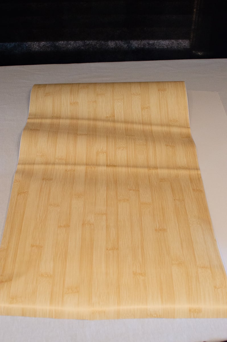 Attach the bamboo contact paper to the foam board