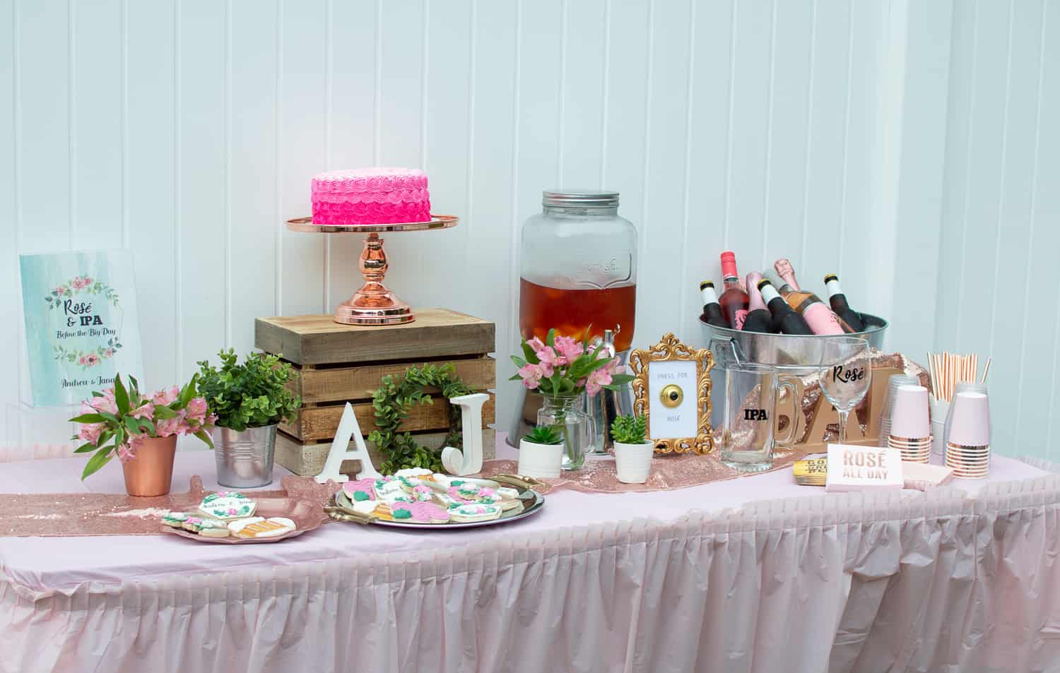 Rosé and IPA dessert and drinks table at a couples wedding shower