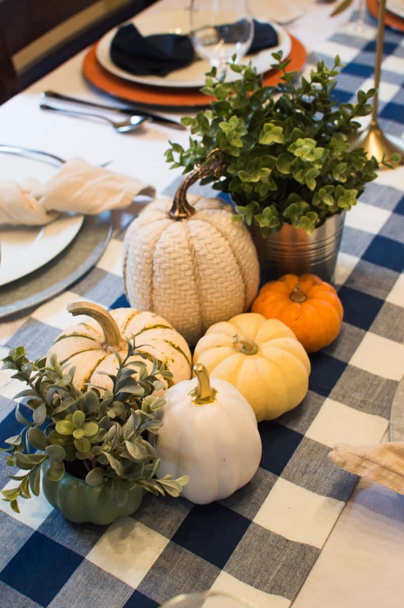 Thanksgiving pumpkin and greenery centerpiece